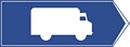 Znak wskazujący przejazd tranzytowy umieszczany na skrzyżowaniu